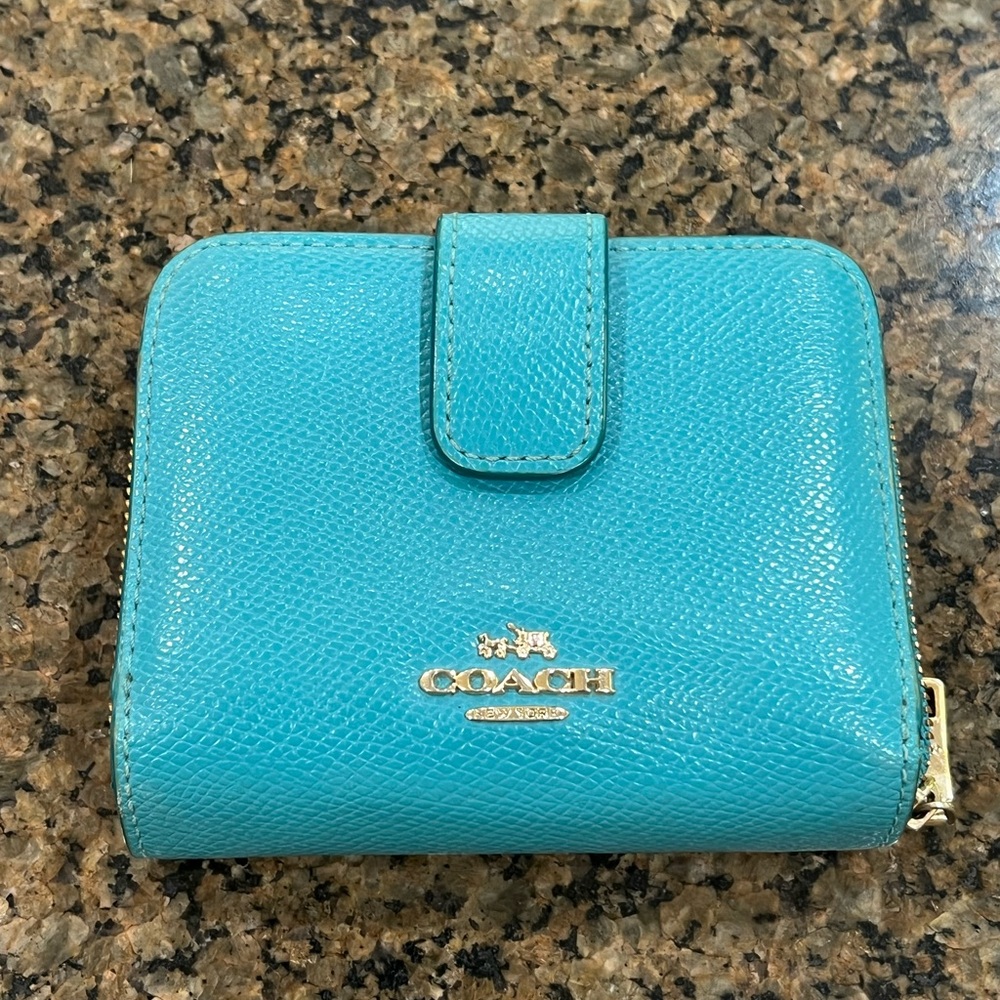 Coach wallet with zip and snap closures